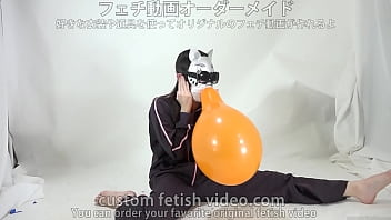 A girl inflates and splits a balloon