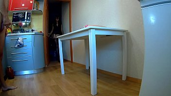 Stretching the ass of a longlegged beauty in a white bodysuit on the kitchen table